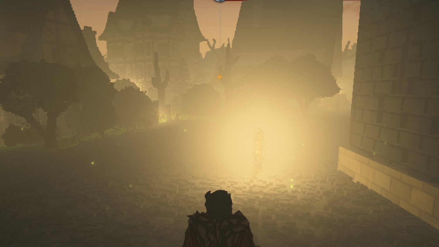 A lit gate glowing through fog at night